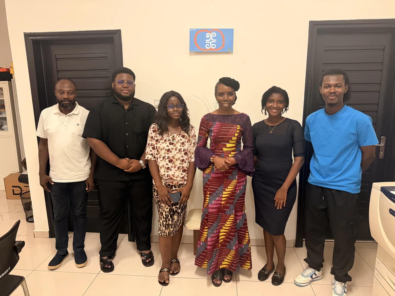 Six members of the engineering collaboration team standing together in an office