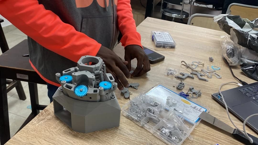 Microscopy hardware being assembled on a workbench