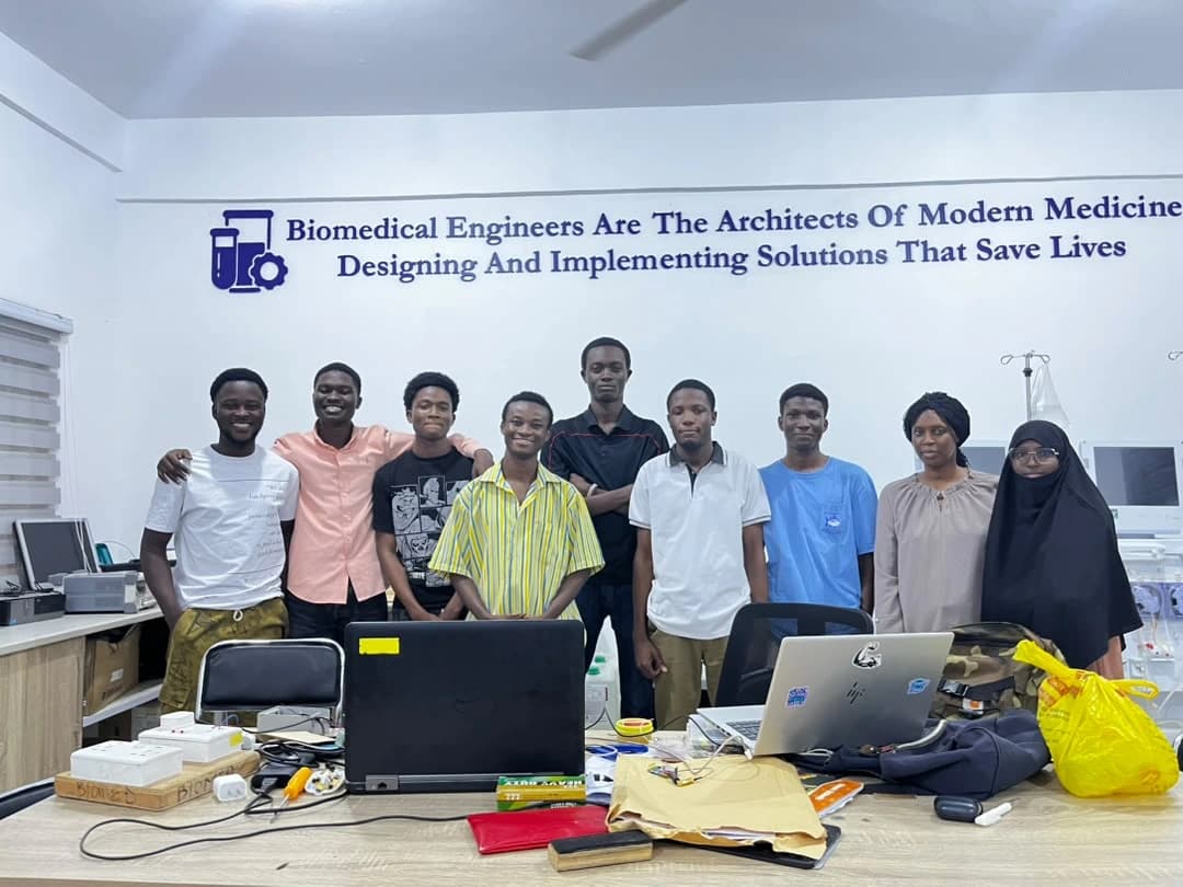Engineering project team together in a biomedical engineering workspace